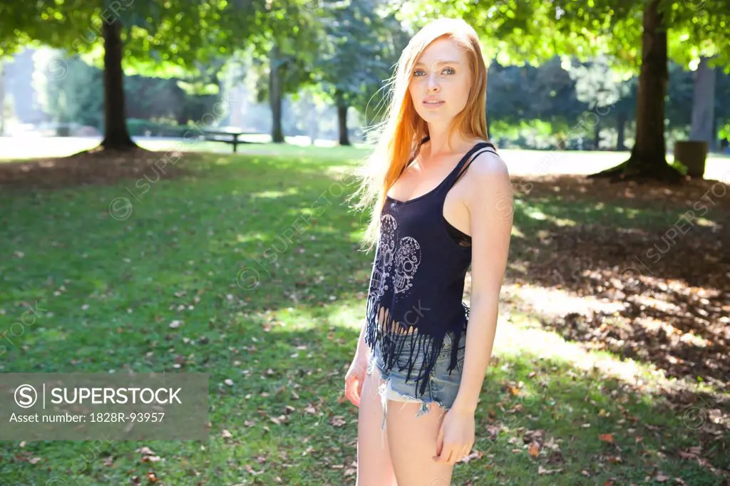 Portrait of young woman in park on a warm summer day in Portland, Oregon, USA