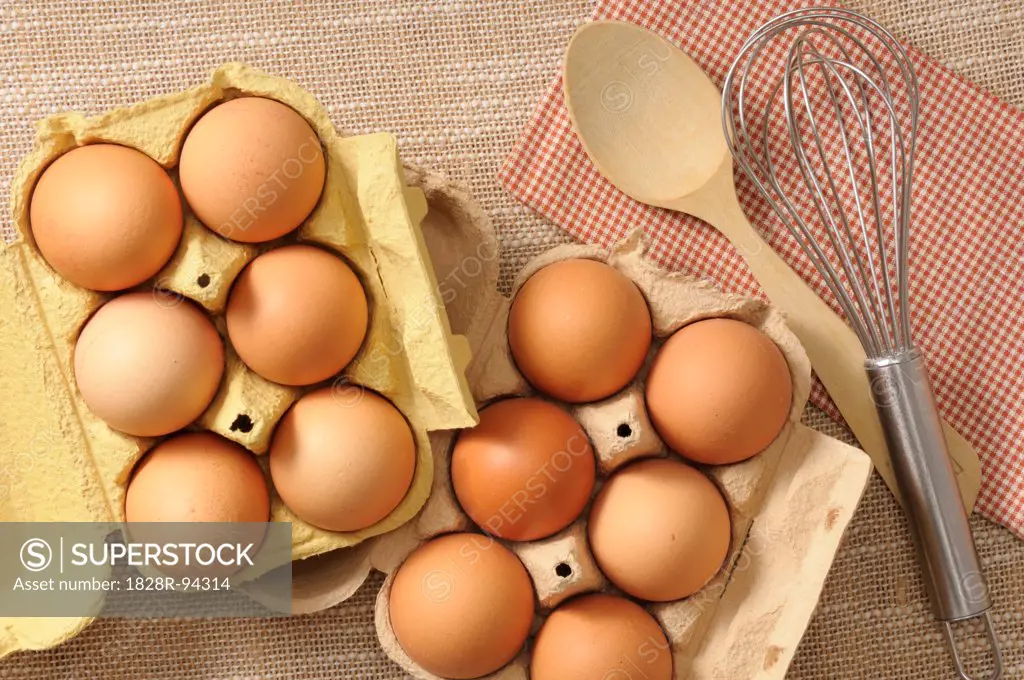 Overhead View of Eggs with Wooden Spoon, Whisk and Napkin