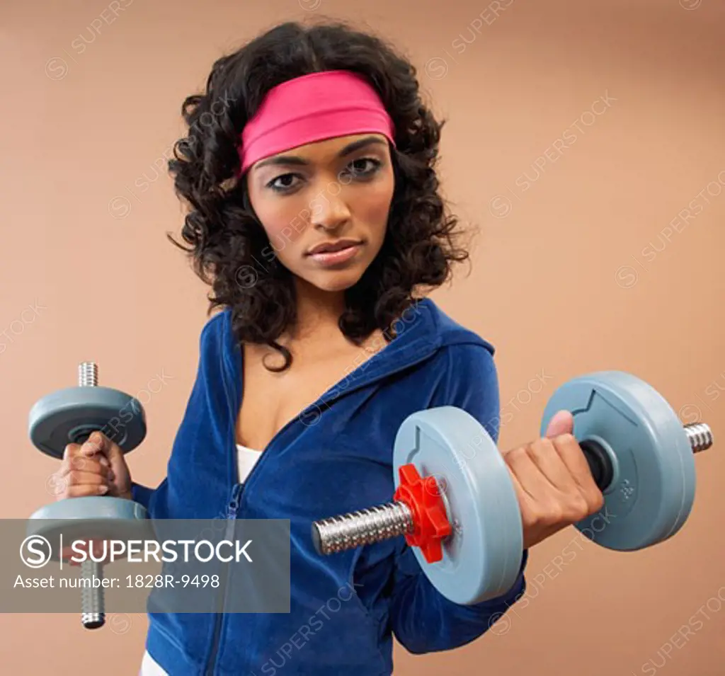 Portrait of Woman Lifting Weights   