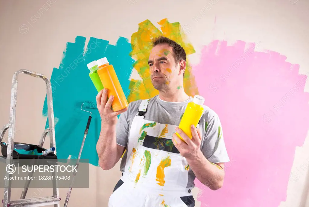 Mature Man Renovating his Home and Deciding between Paint Colors