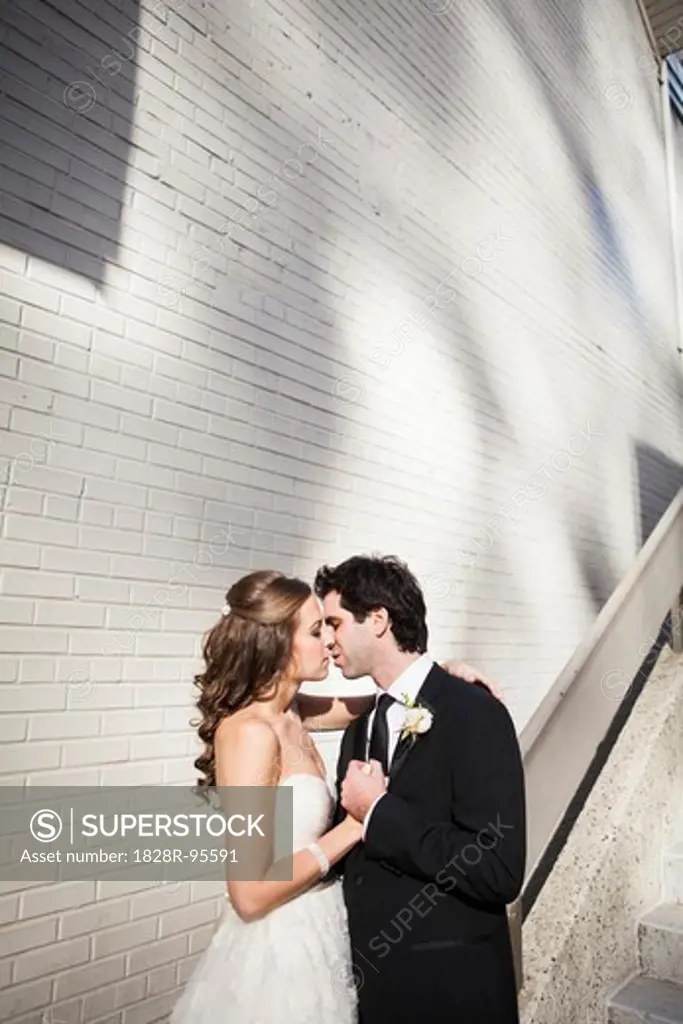 Portrait of Bride and Groom Kissing, Toronto, Ontario, Canada,11/12/2011