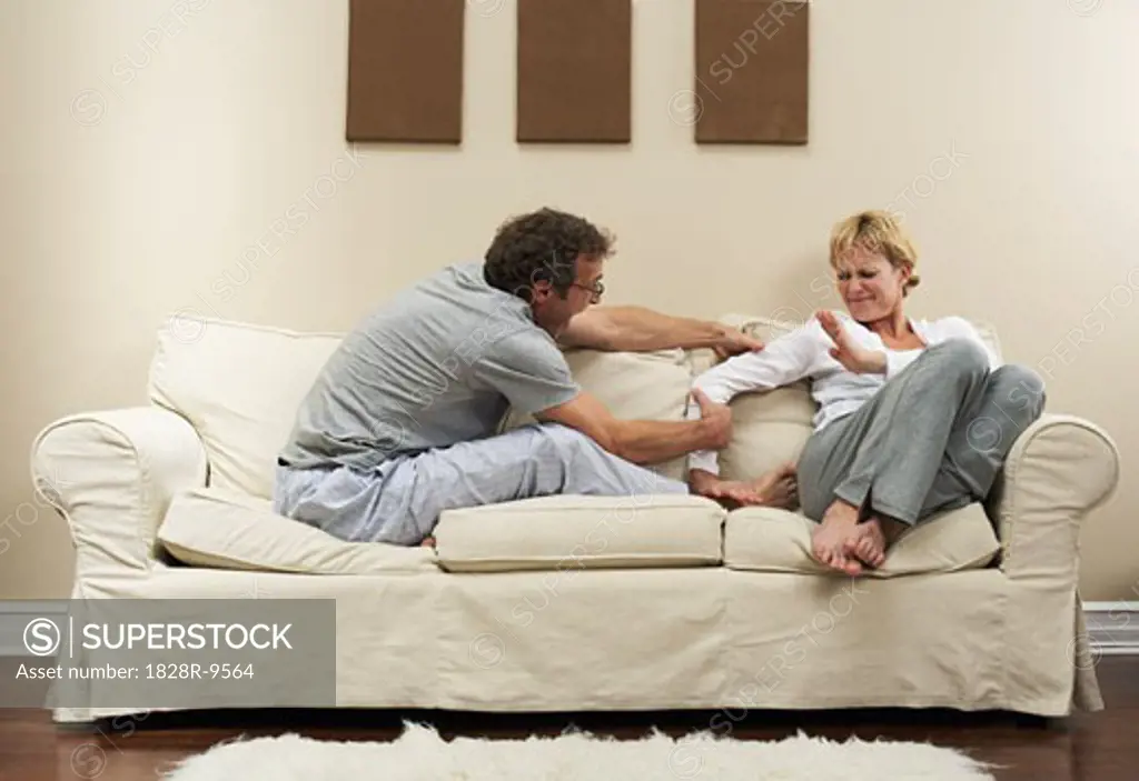 Couple Arguing on Sofa   