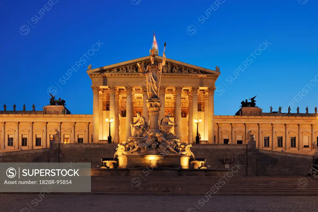 Austrian Parliament and Pallas Athene statue in Vienna illuminated at dusk. Vienna, Austria.,06/08/2010