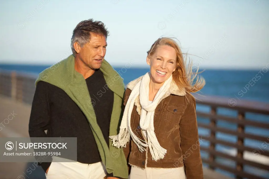 Mature Couple Walking along Pier, Jupiter, Palm Beach County, Florida, USA,03/13/2013