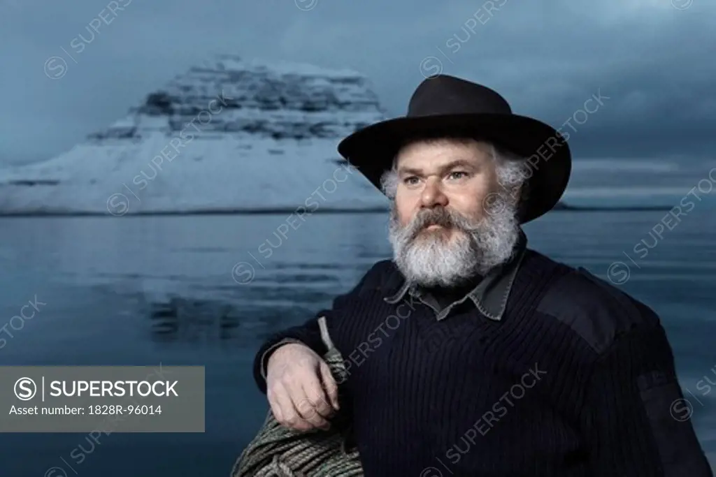 Fisherman with gray beard on his boat, on a winter day, Iceland.,01/29/2007