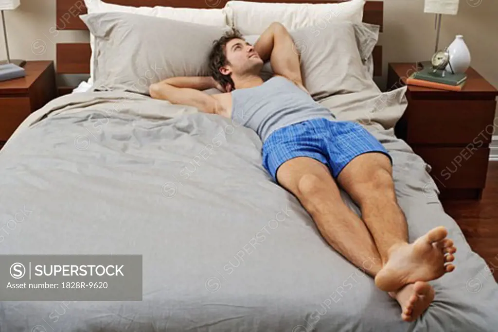 Man Lying on Bed   