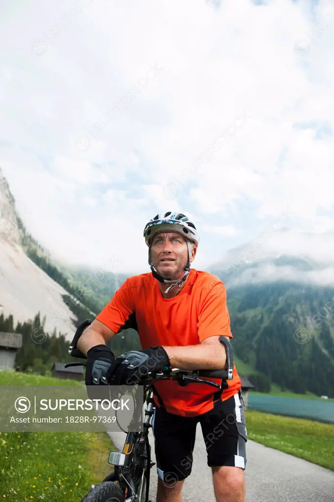 Mature Man Mountain Biking at Vilsalpsee, Tannheim Valley, Tyrol, Austria,06/14/2013