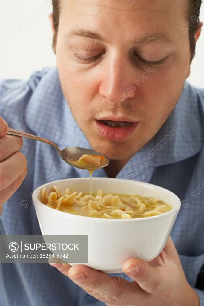 Man Eating Chicken Soup   