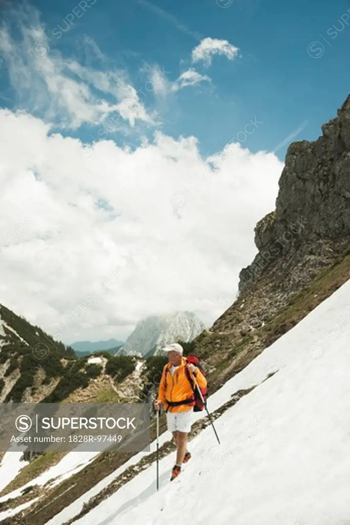 Mature man hiking in mountains, Tannheim Valley, Austria,06/15/2013