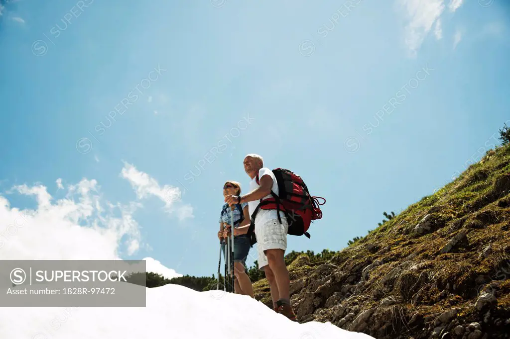 Mature couple hiking in mountains, Tannheim Valley, Austria,06/15/2013
