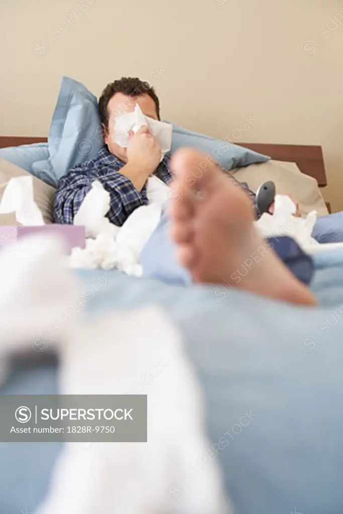 Man Sick in Bed   