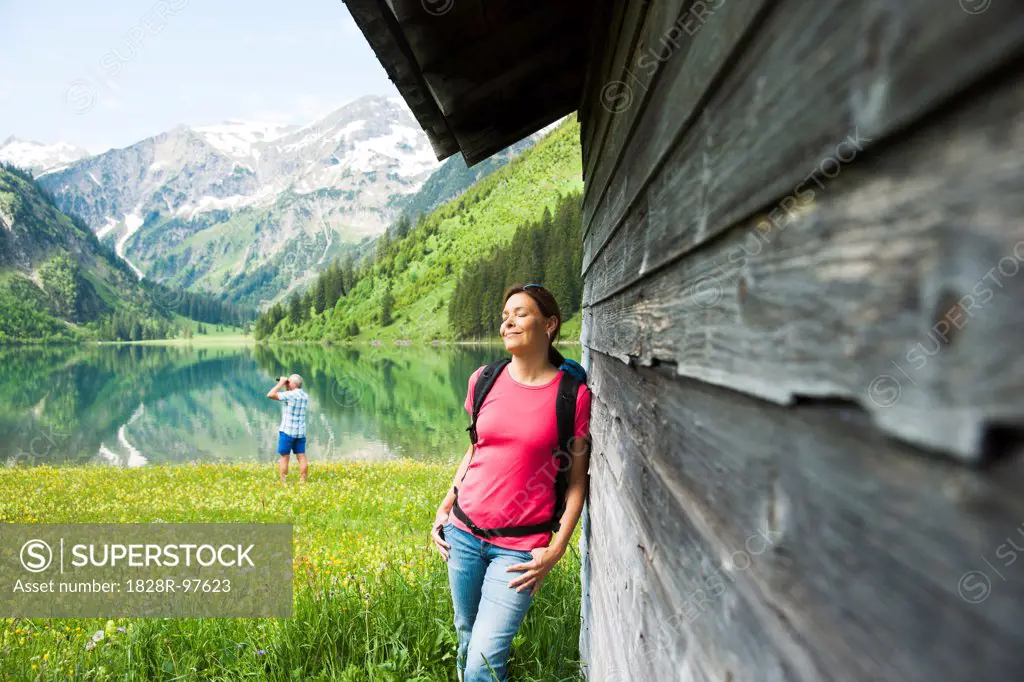 Couple Hiking by Lake, Vilsalpsee, Tannheim Valley, Tyrol, Austria,06/15/2013