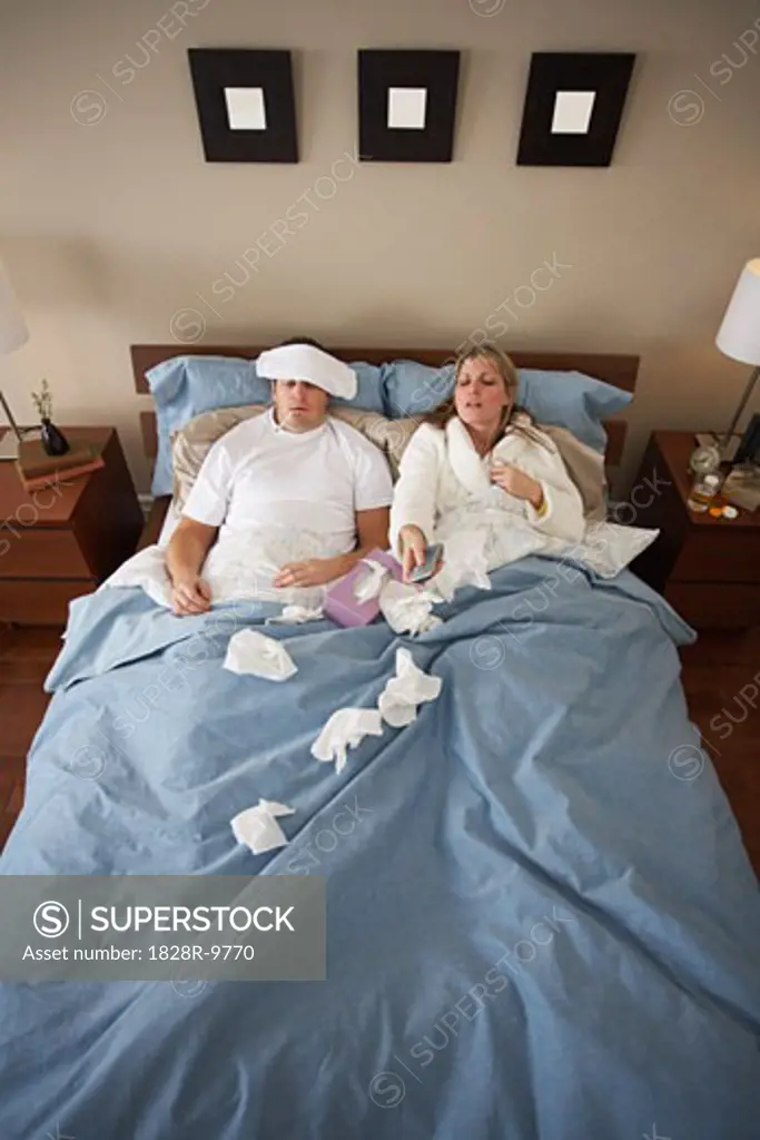 Sick Couple in Bed   