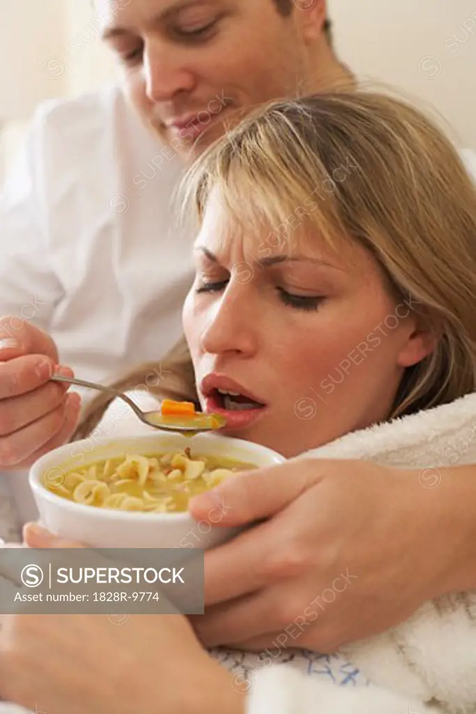 Sick Woman Eating Chicken Soup   