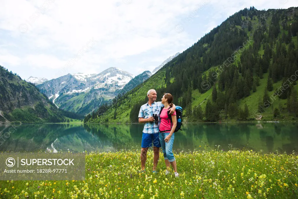 Mature couple hiking in mountains, Lake Vilsalpsee, Tannheim Valley, Austria,06/15/2013