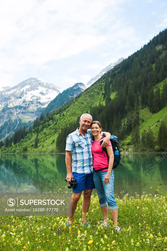 Portrait of mature couple hiking in mountains, Lake Vilsalpsee, Tannheim Valley, Austria,06/15/2013