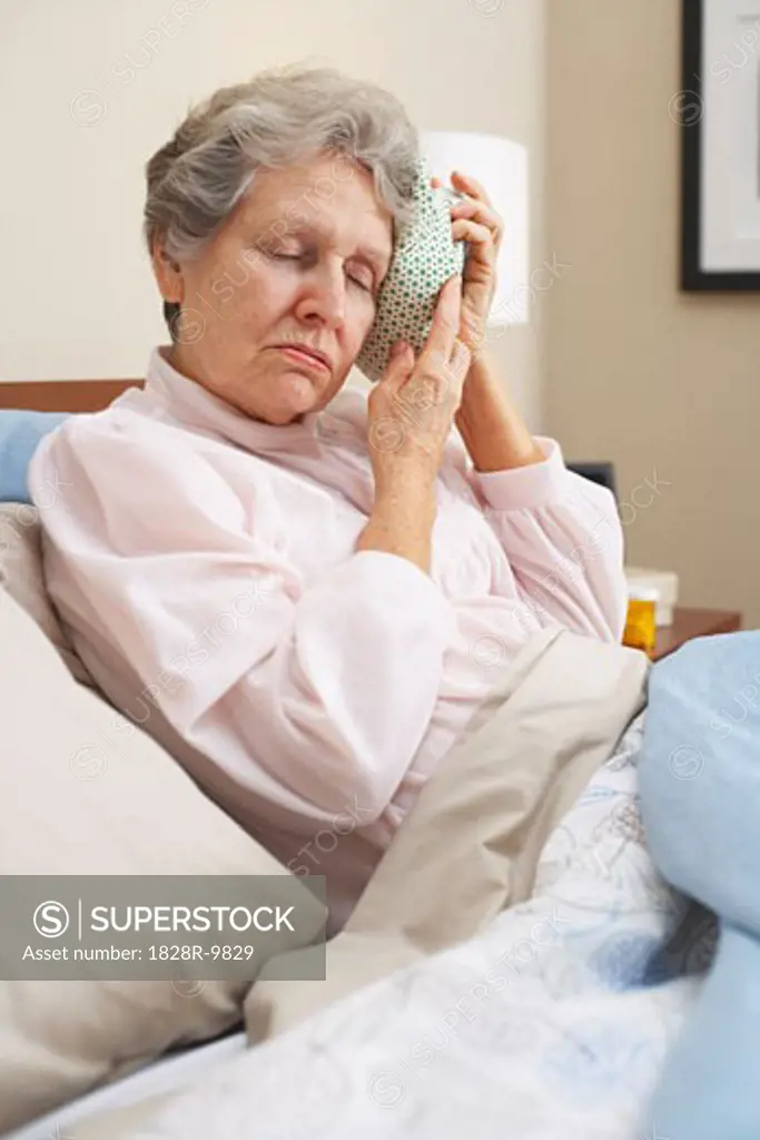 Portrait of Woman Using Ice Pack   