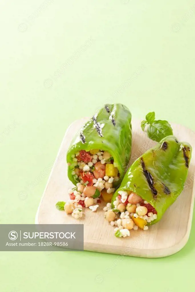 Grilled Green Peppers Stuffed with Israeli Couscous, Chickpeas and Vegetables on Cutting Board, Studio Shot,03/11/2011