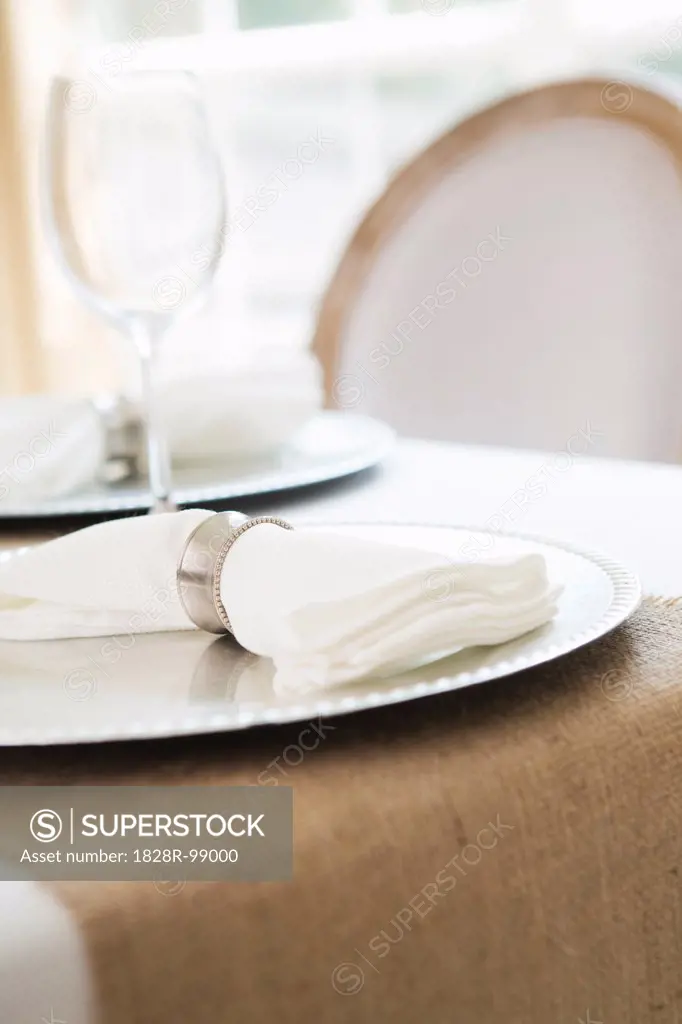 Simple and elegant place setting with plate charger and napkin. 08/24/2013