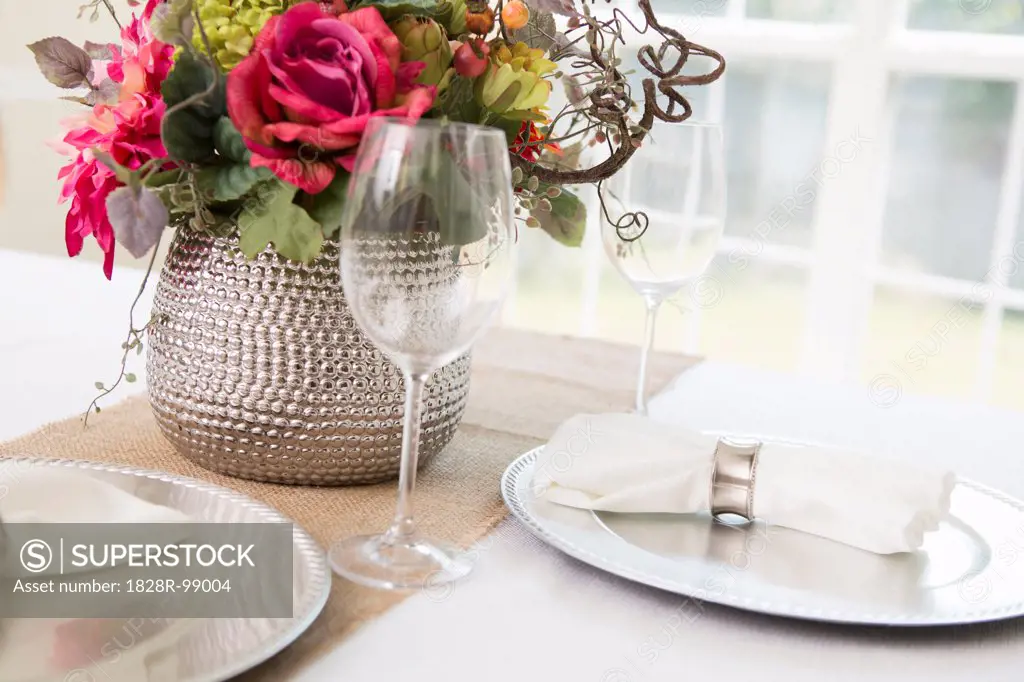 Elegant table setting at wedding event with plate charger and napkin. 08/24/2013