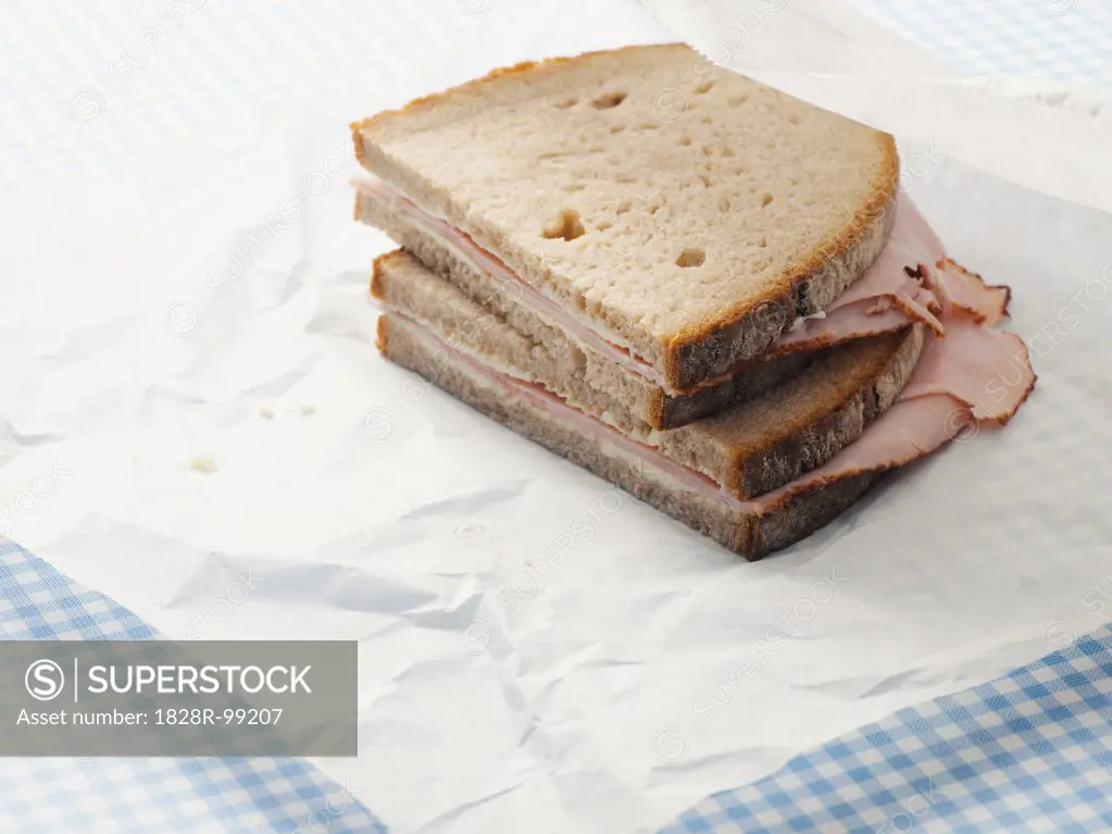 Close-up of Ham Sandwich on Parchment Paper. 09/03/2013