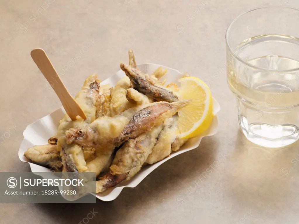 Fried Sardines with Glass of Water, Studio Shot. 09/15/2013