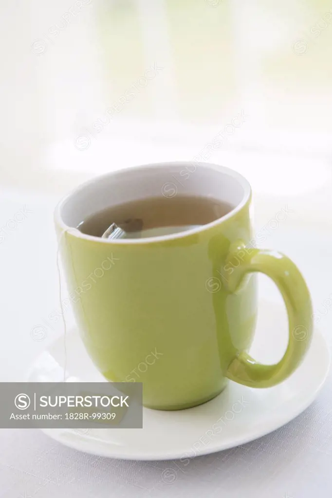 Cup of Tea in Green Mug with Saucer, Studio Shot. 09/04/2013