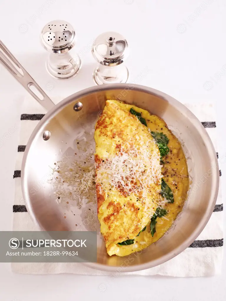Overhead View of Omelette in Frying Pan with Salt and Pepper, Studio Shot. 10/07/2013