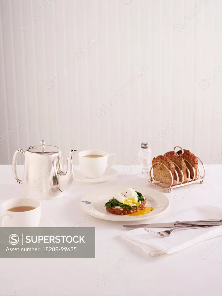 Breakfast of Poached Egg on Toast with Tea, Studio Shot. 10/07/2013