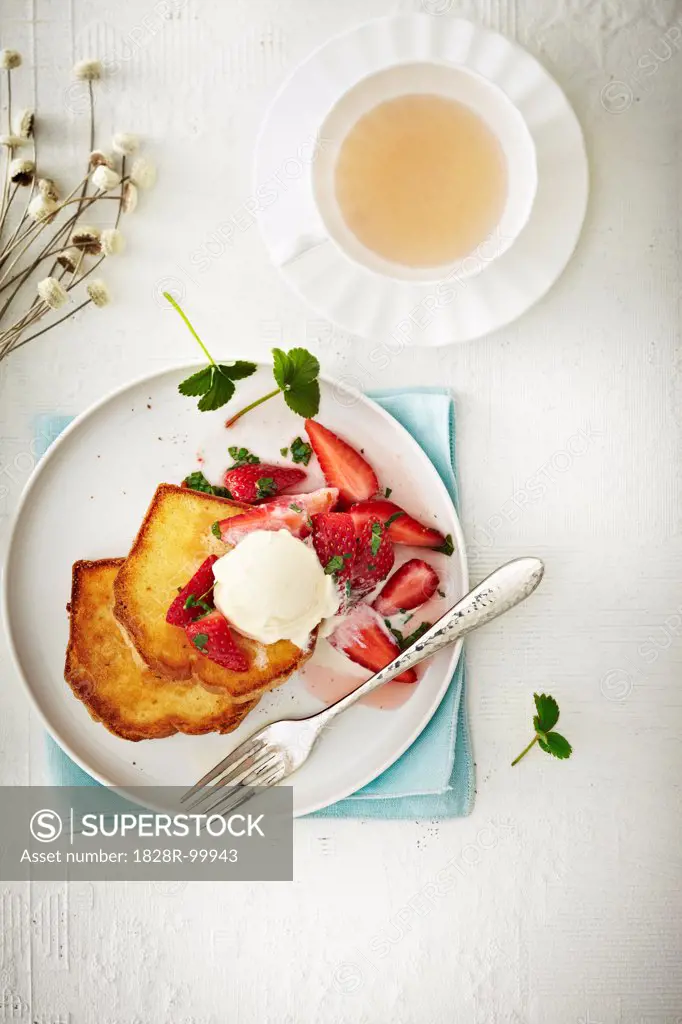 Overhead View of Strawberries on French Toast with Ice Cream and cup of Tea, Studio Shot. 04/20/2011