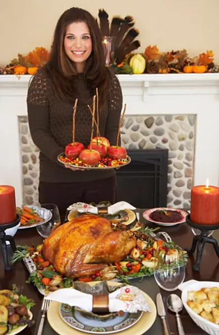 Woman Serving Thanksgiving Dinner  