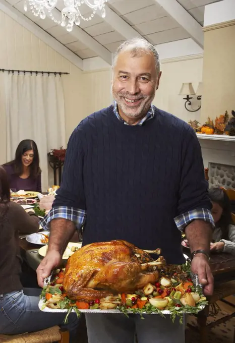 Man Holding Thanksgiving Turkey  