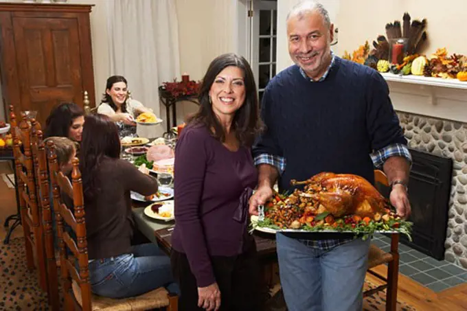 Couple with Thanksgiving Turkey  