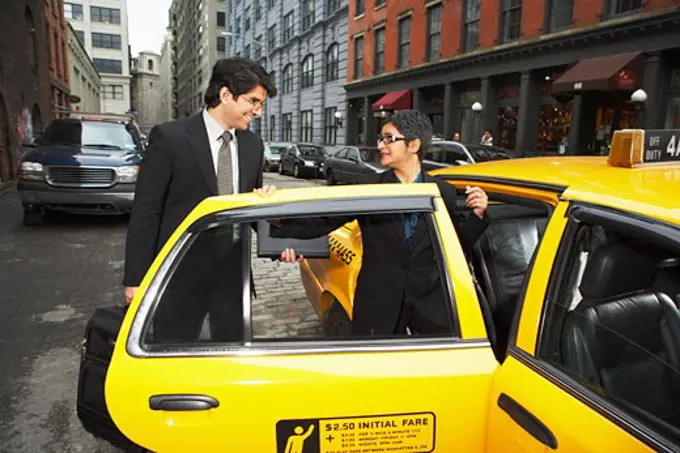 Business People next to Taxi, New York City, New York, USA   