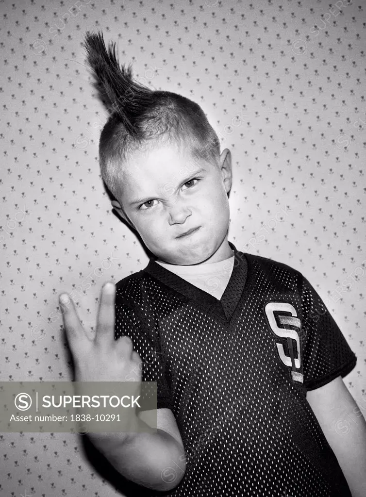 Young Boy With Mohawk Haircut Holding Up Two Fingers
