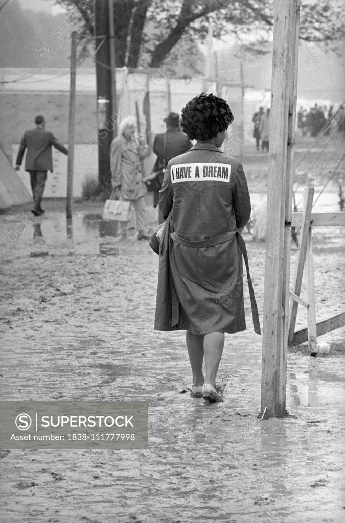 Rear View of African-American Woman wearing a "I Have a Dream" Jacket Walking through Mud in Shantytown known as "Resurrection City", Washington, D.C., USA, photographer Thomas J. O'Halloran, Marion S. Trikosko, May 24, 1968