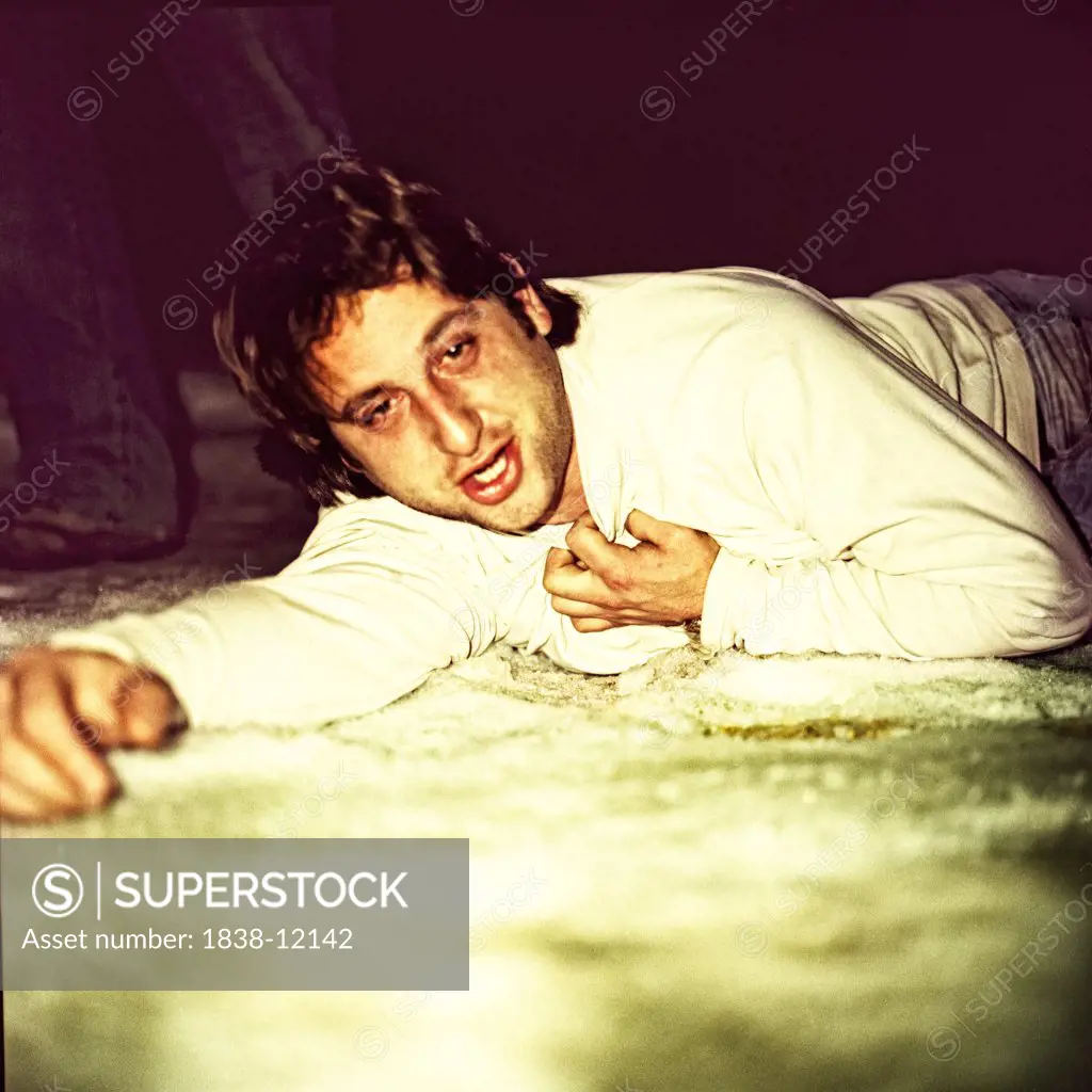 Intoxicated Man Laying on Ground