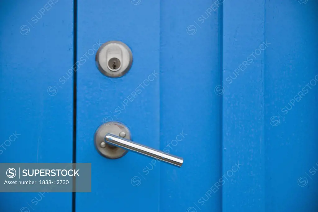Lock and Metal Handle on Blue Door