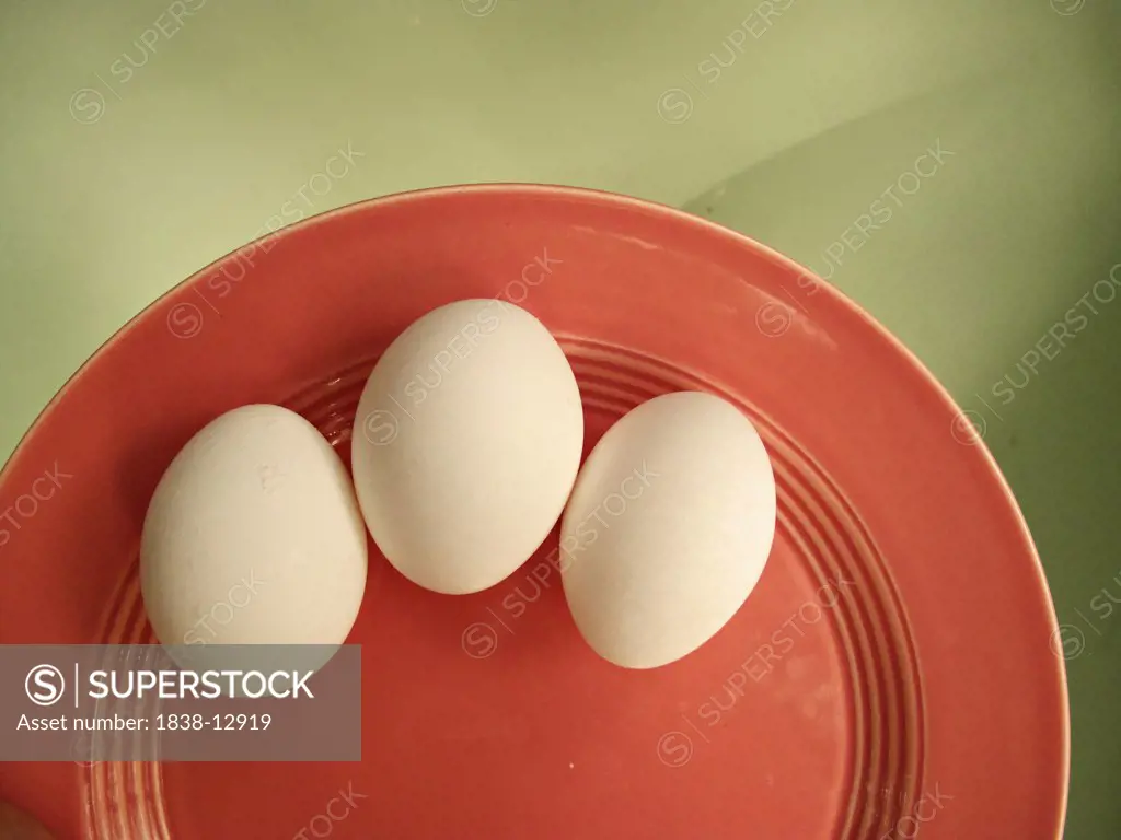 Three White Eggs on Vintage Plate