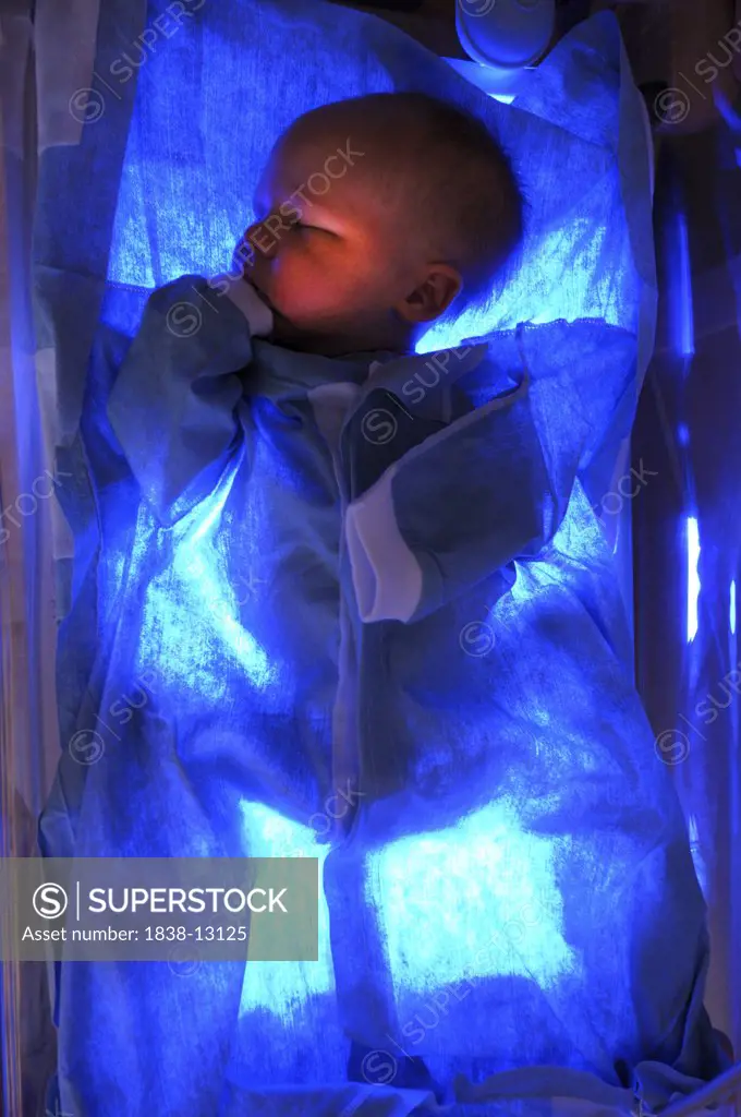 Newborn Baby Receiving Light Therapy From Bilirubin Blanket