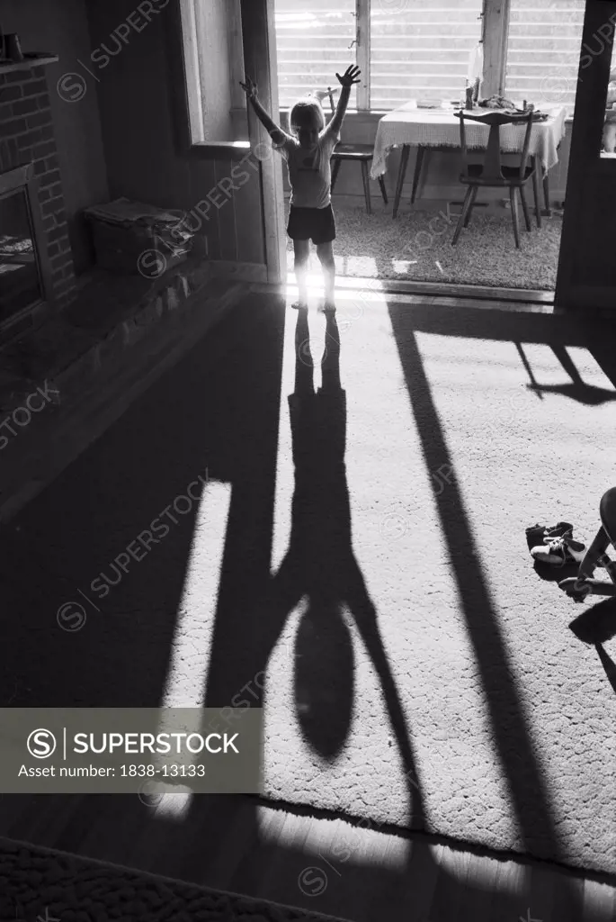 Boy Looking at his Shadow