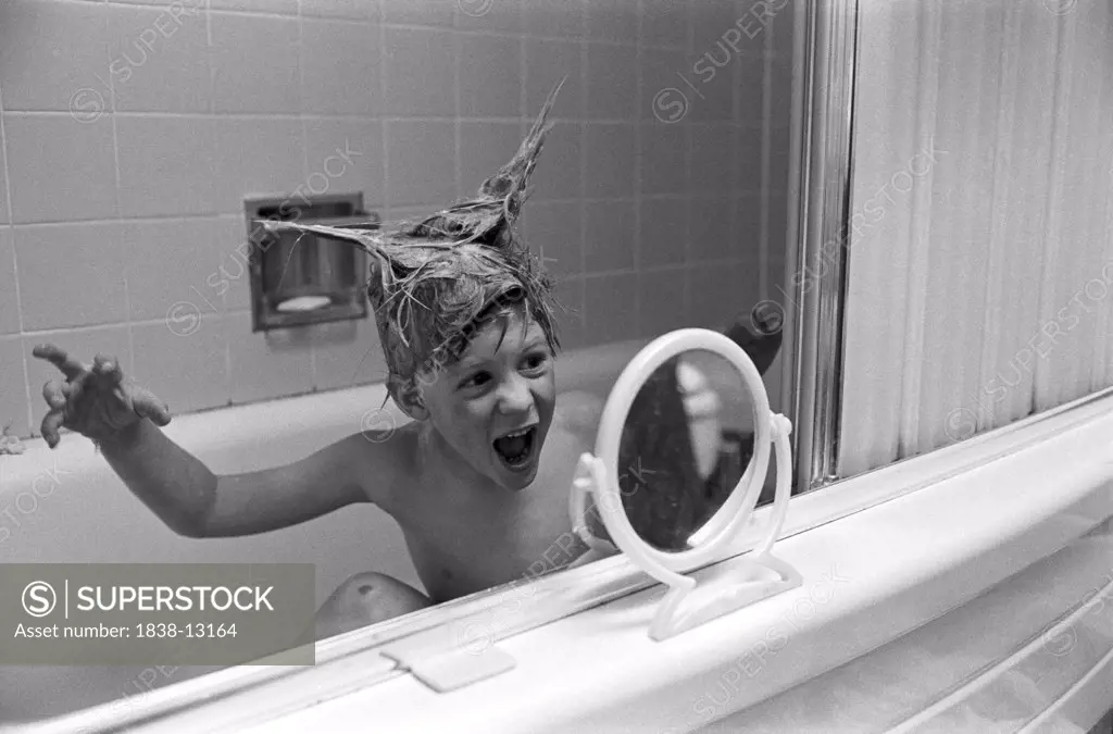 Young Boy Playing in Bathtub