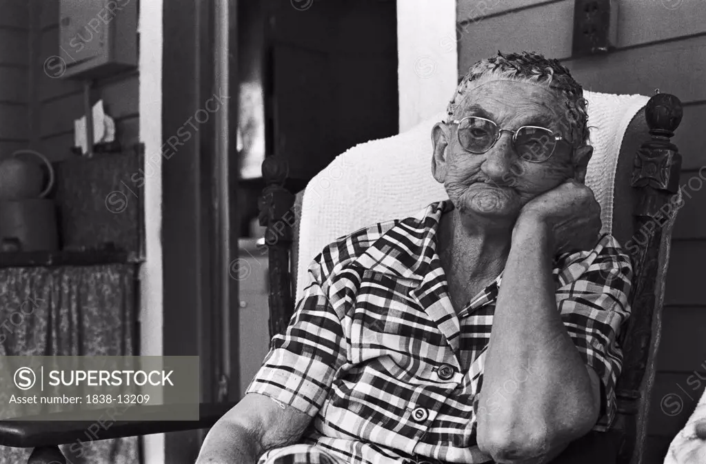 Bored Elderly Woman Sitting on Porch