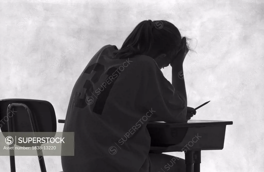 Pensive Student at Desk