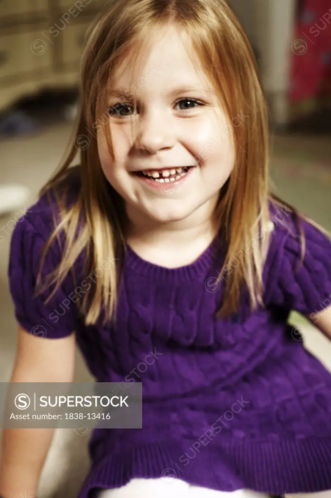 Smiling Girl in Purple Dress