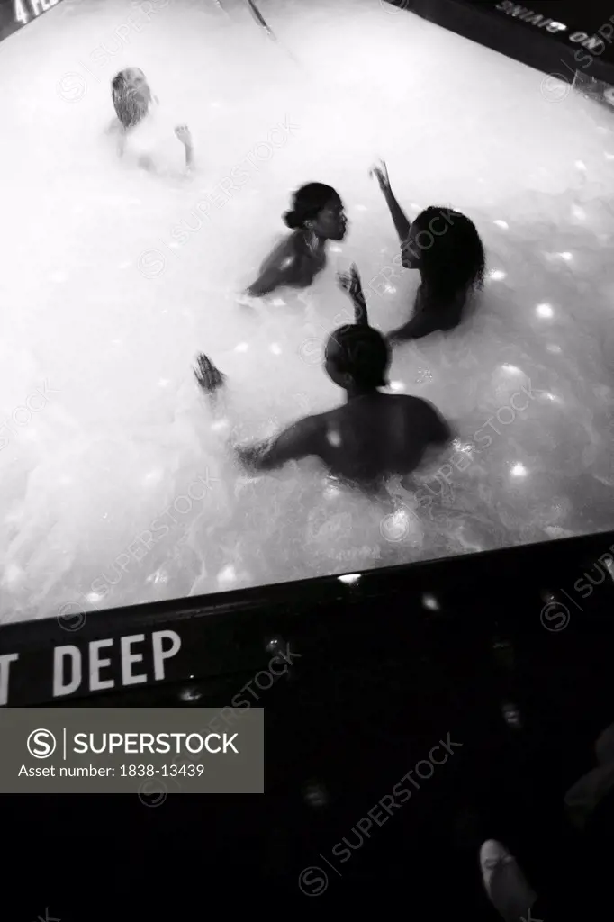 Group of People in Swimming Pool in Nightclub, New York City, USA
