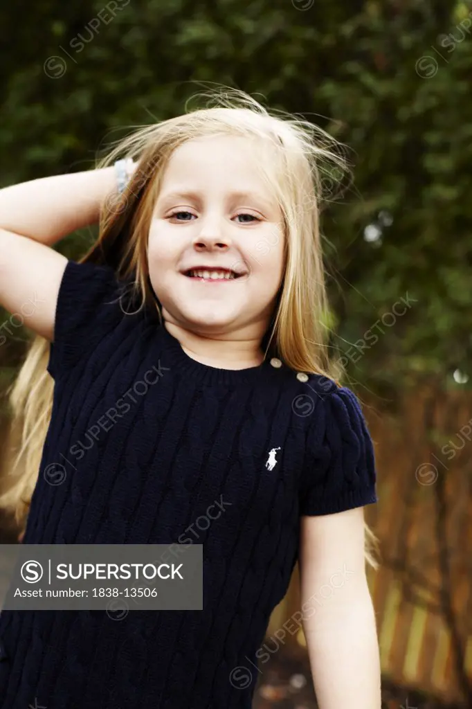 Young Smiling Girl in Navy Blue Dress, Close Up