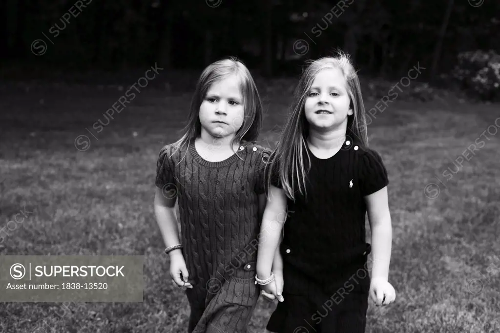 Two Young Girls Holding Hands