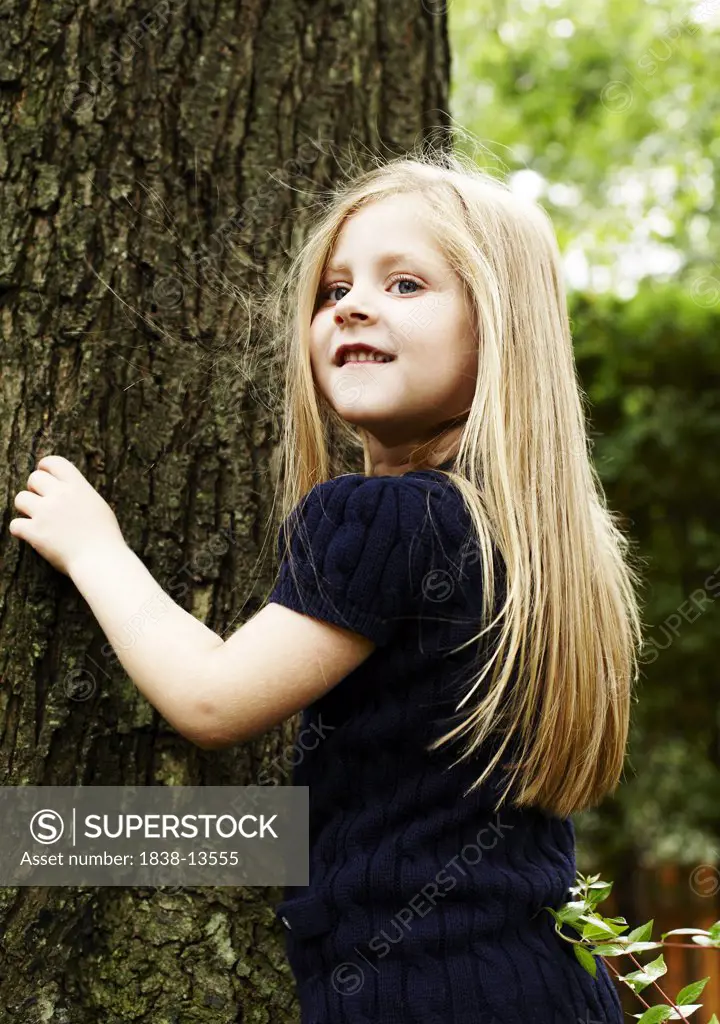 Smiling Girl With Long Blond Hair