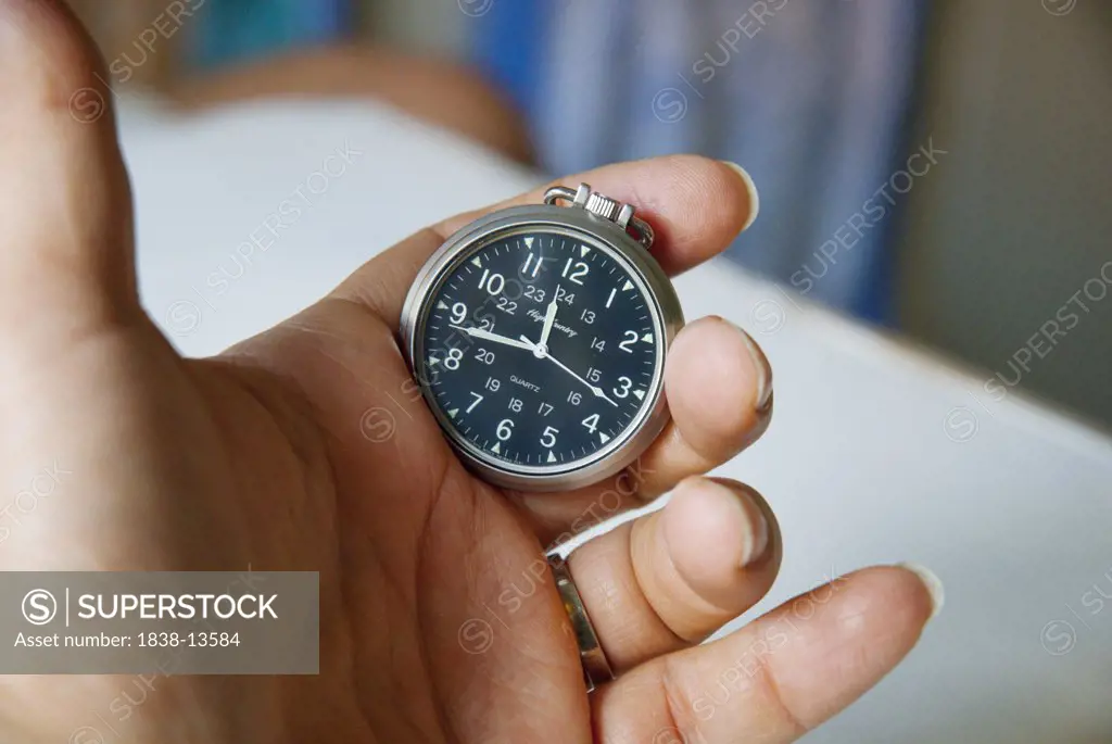 Man Holding Pocket Watch